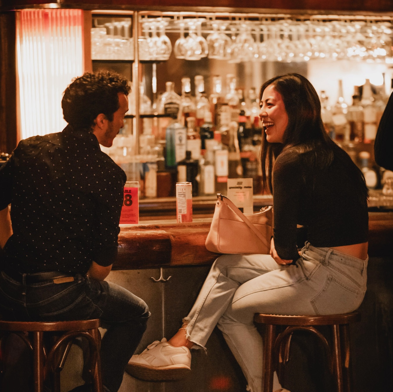 Two attendees mid-conversation at a TNFM event