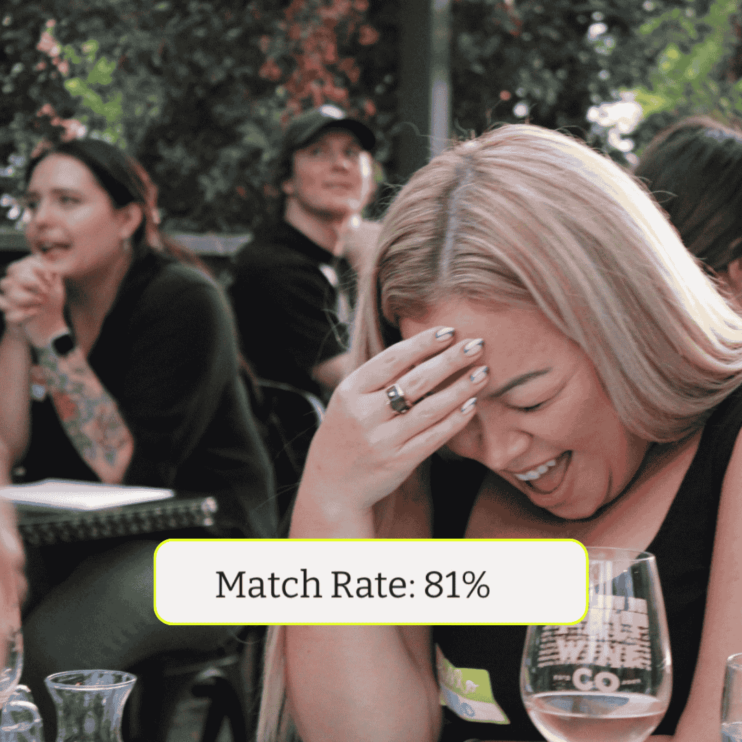 A speed friending event with guests laughing